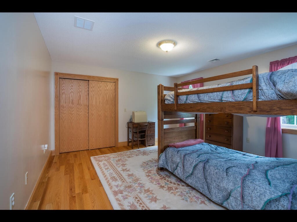 20 Paradise Lake Road Monson, MA 01057 - Photo 37 of 42 a bedroom with a bed and a flat screen tv