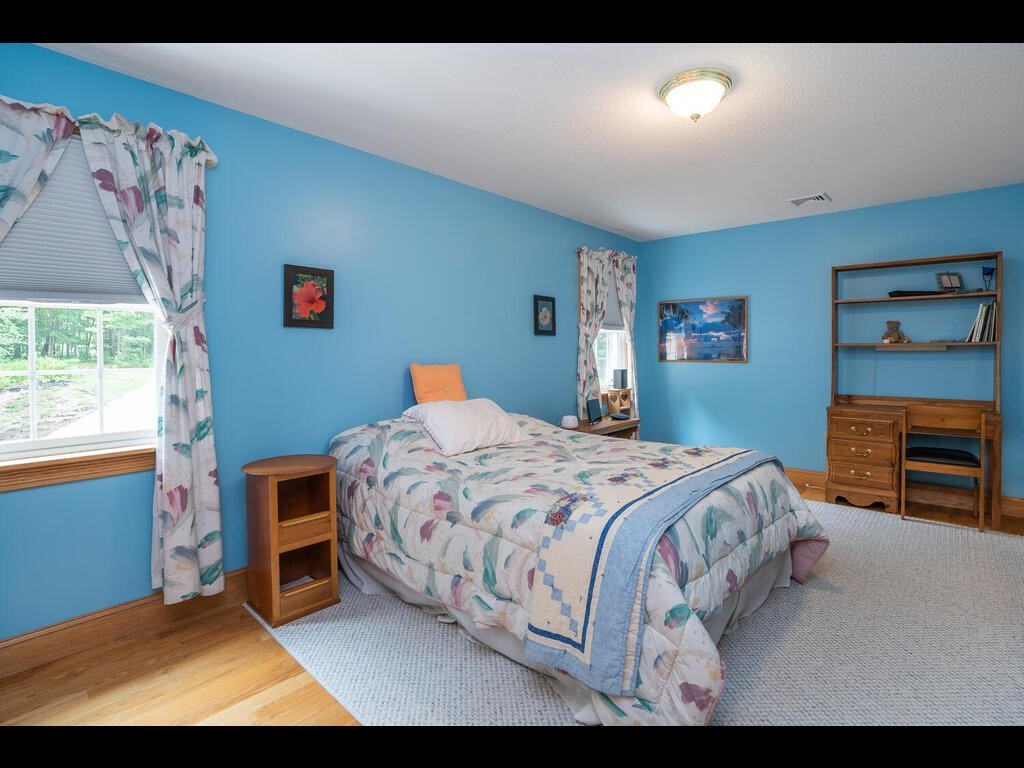 20 Paradise Lake Road Monson, MA 01057 - Photo 39 of 42 a bedroom with a bed and a tv on the dresser