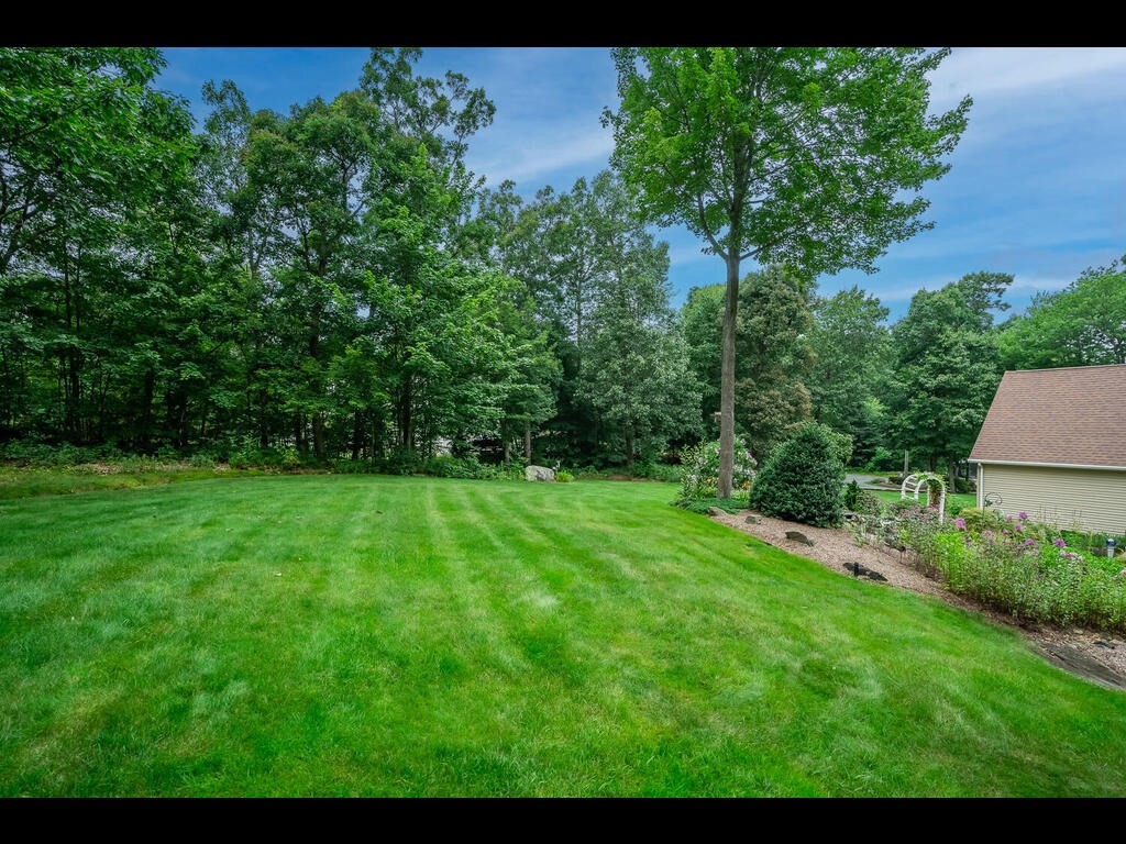 20 Paradise Lake Road Monson, MA 01057 - Photo 5 of 42 a view of a yard and front view of a house