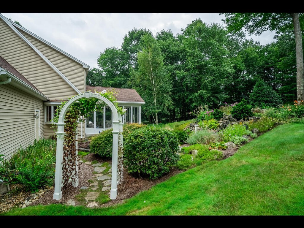 20 Paradise Lake Road Monson, MA 01057 - Photo 9 of 42 a front view of house with yard and green space