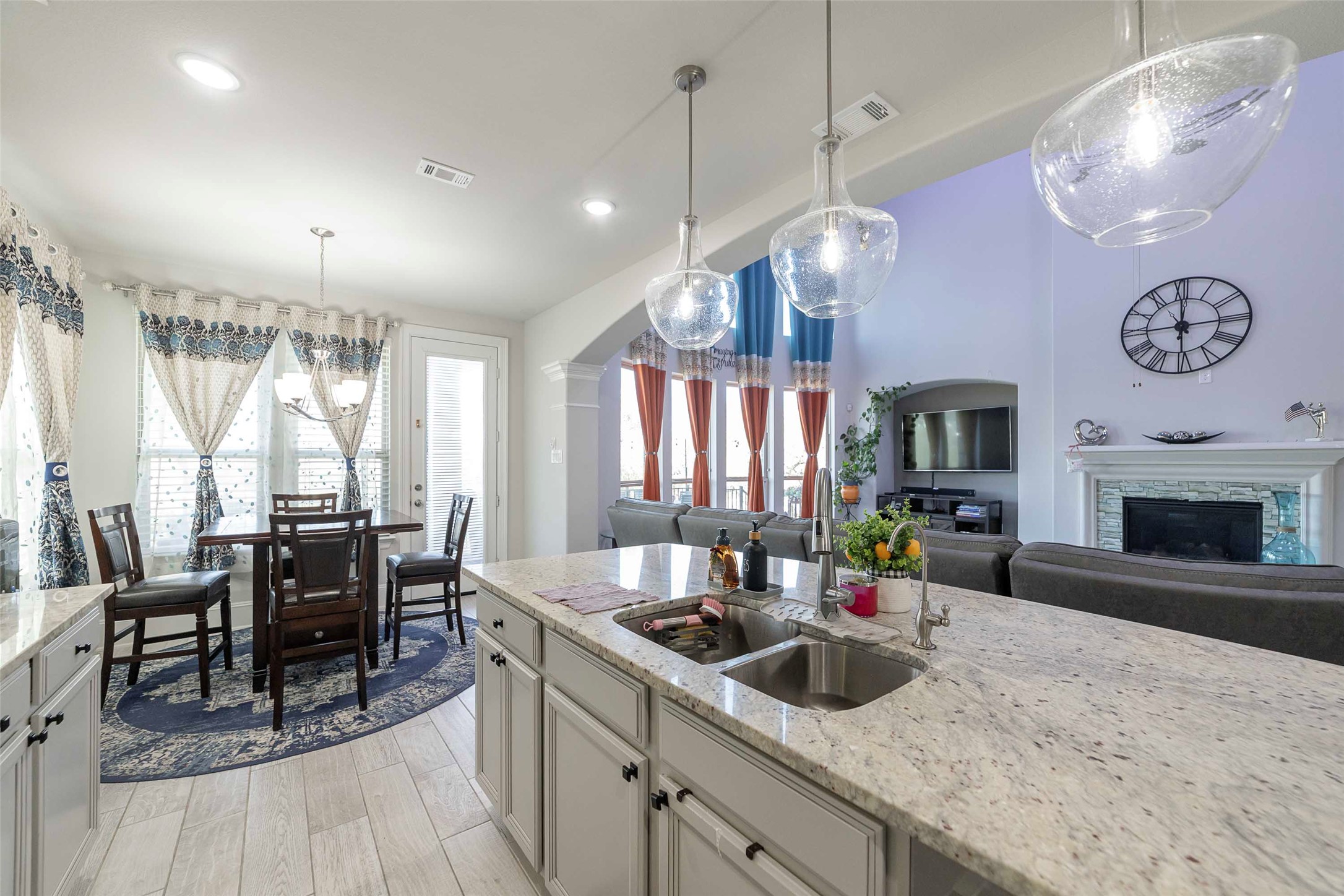 17821 Limestone Spring Lane Austin, TX 78738 - Photo 14 of 40 a kitchen with sink table and chairs