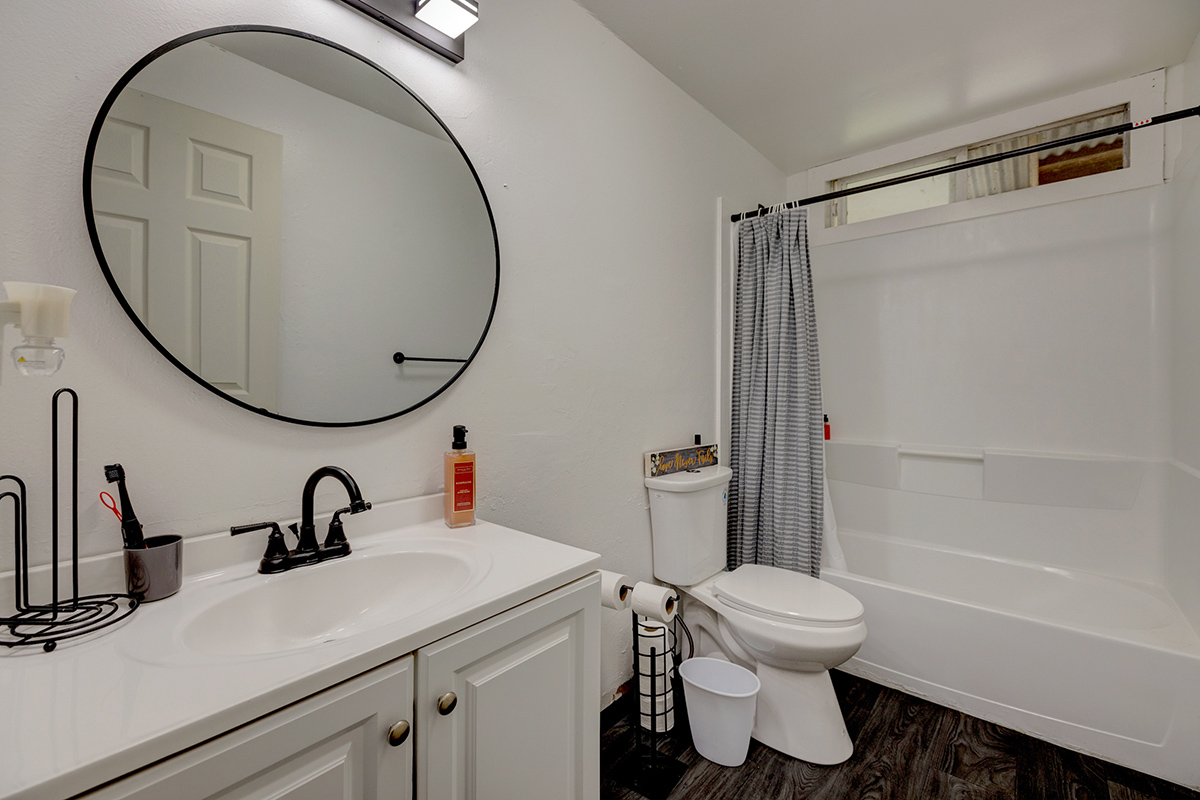 18-1248 Thorne Parkway Mountain View, HI 96771 - Photo 11 of 25 a bathroom with a sink a toilet and a mirror