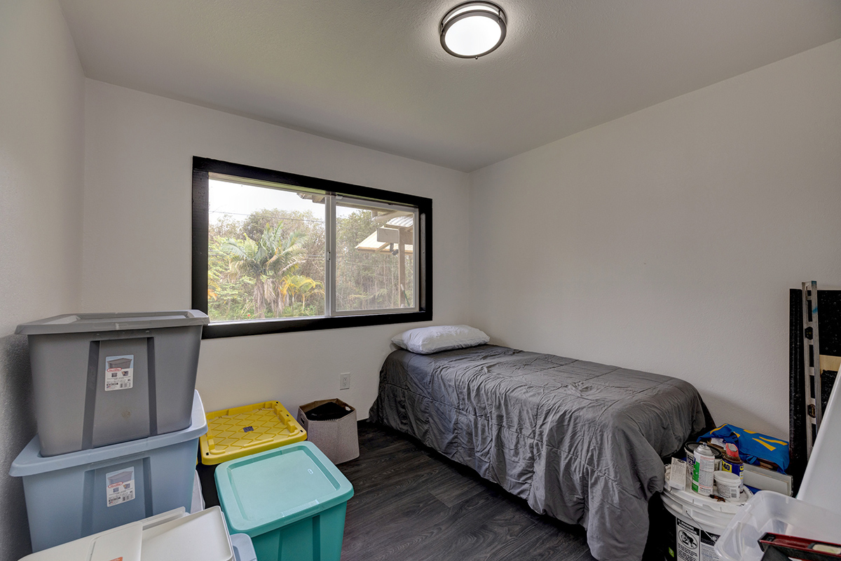 18-1248 Thorne Parkway Mountain View, HI 96771 - Photo 12 of 25 a bedroom with a bed and window