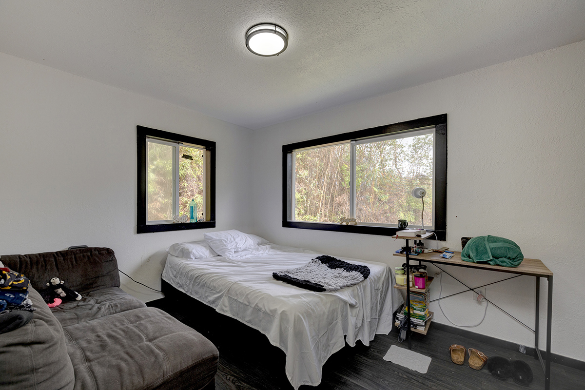 18-1248 Thorne Parkway Mountain View, HI 96771 - Photo 13 of 25 a bedroom with bed and window