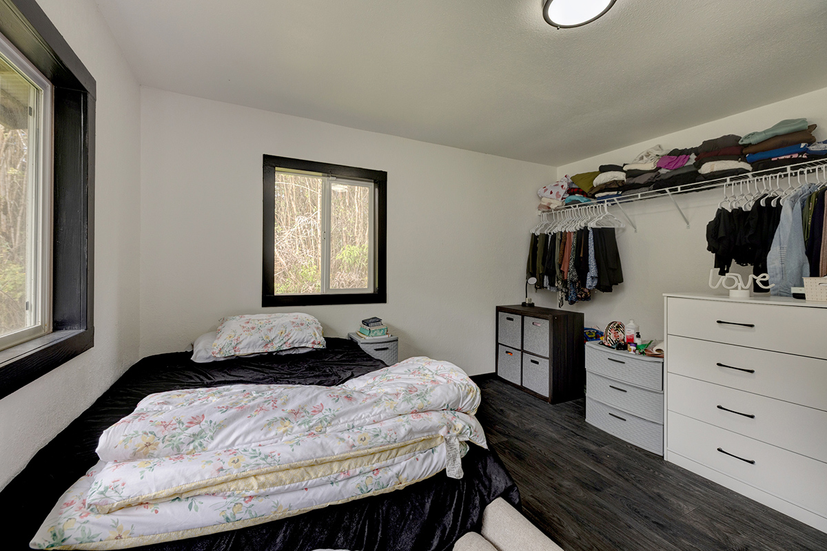 18-1248 Thorne Parkway Mountain View, HI 96771 - Photo 15 of 25 a bedroom with a bed and a window