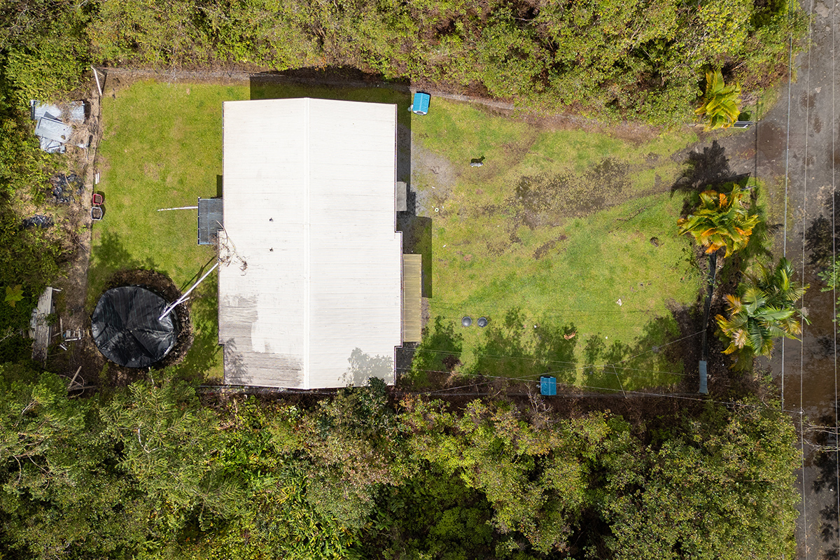 18-1248 Thorne Parkway Mountain View, HI 96771 - Photo 23 of 25 a building with a yard