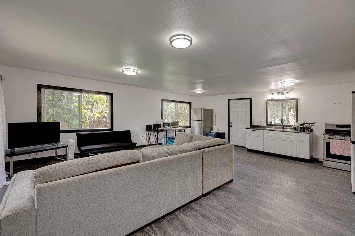 18-1248 Thorne Parkway Mountain View, HI 96771 - Photo 6 of 25 a living room with furniture and a flat screen tv