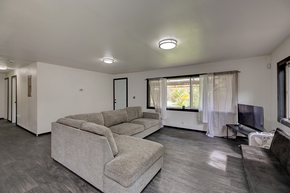 18-1248 Thorne Parkway Mountain View, HI 96771 - Photo 9 of 25 a living room with furniture and a flat screen tv