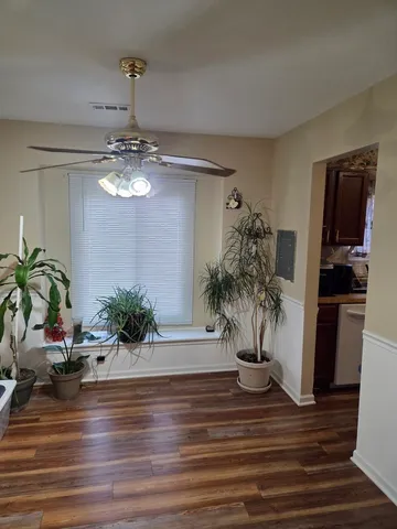 a view of a living room and kitchen