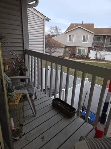 a front view of a house with a deck