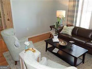 a living room with furniture and a table