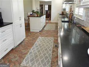 a view of a living room and dining room