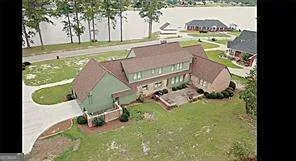 an aerial view of a house with outdoor space