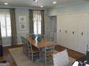 a view of a dining room with furniture and window