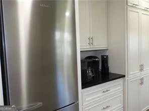 a view of an empty room and fire place