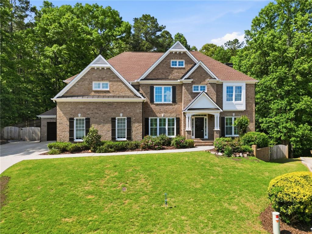 a front view of a house with a yard