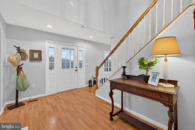 a kitchen with stainless steel appliances a refrigerator and a stove top oven