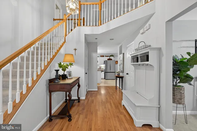 a kitchen with granite countertop a stove top oven and cabinets