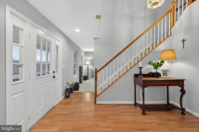 a view of dining room and kitchen with granite countertop wooden cabinets
