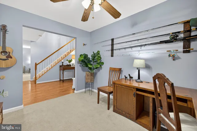 a kitchen with kitchen island granite countertop a sink stainless steel appliances and cabinets