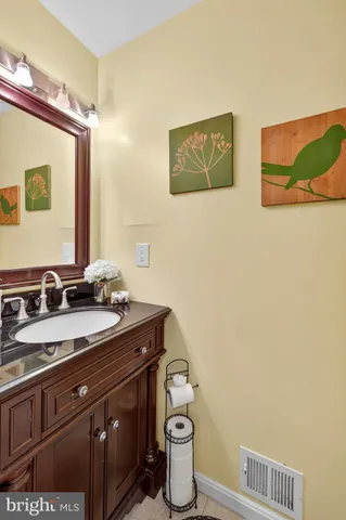 a view of a dining room with furniture and a chandelier