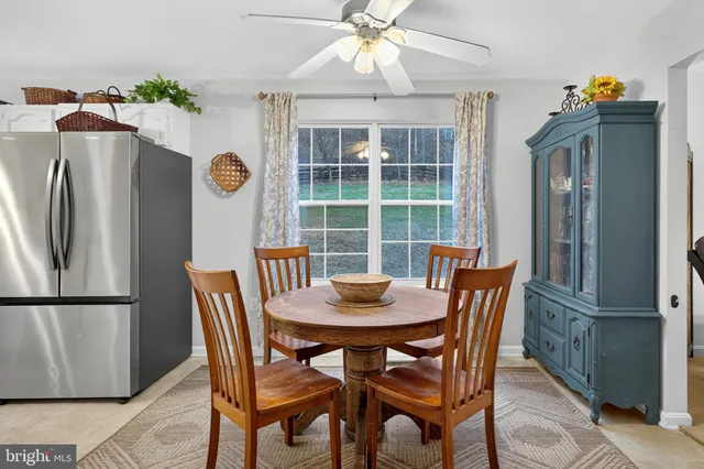 a living room with furniture and a christmas tree