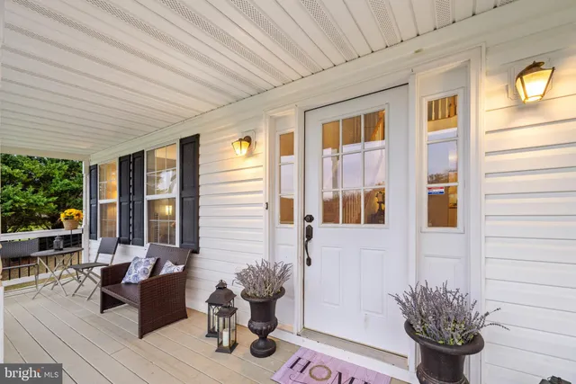 a view of a livingroom with furniture and a potted plant