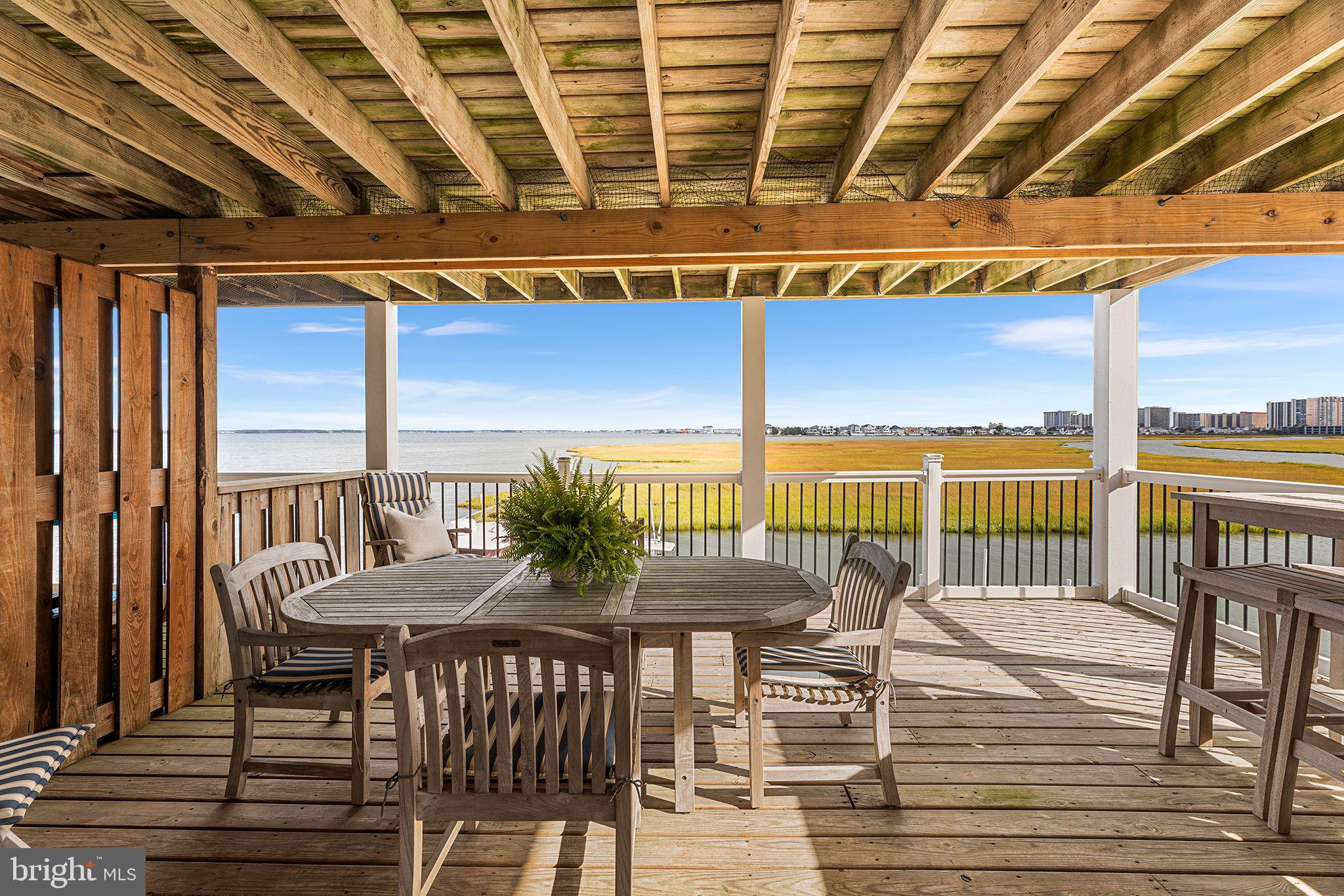 772 94th Street, Unit A Ocean City, MD 21842 - Photo 29 of 36 a balcony with table and chairs
