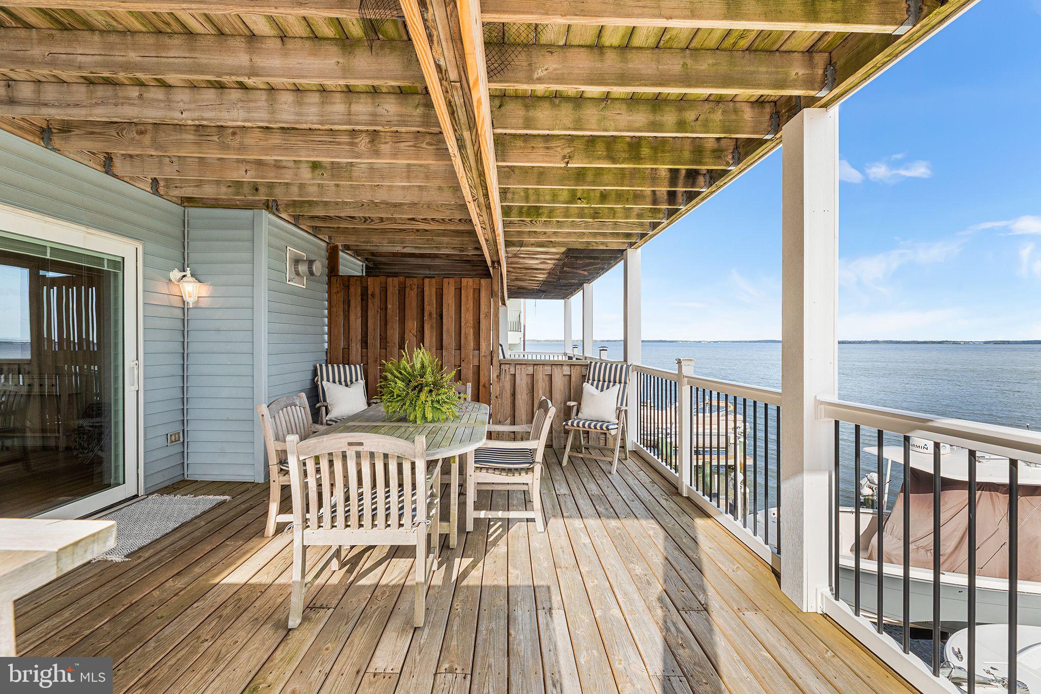 772 94th Street, Unit A Ocean City, MD 21842 - Photo 32 of 36 a view of a roof deck with wooden floor and fence