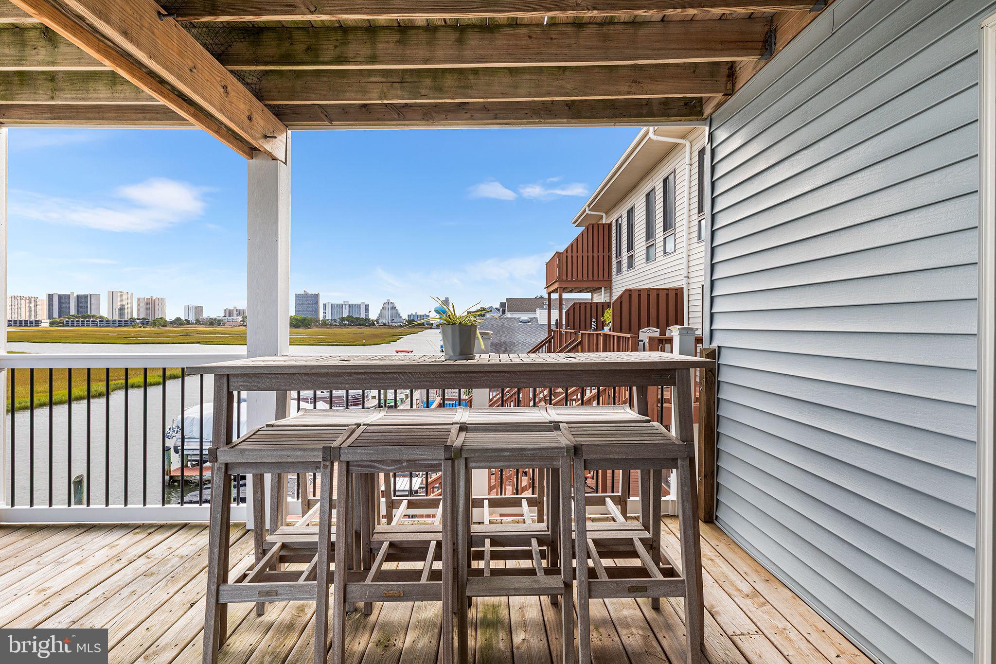 772 94th Street, Unit A Ocean City, MD 21842 - Photo 33 of 36 a view of a chairs and table in the balcony