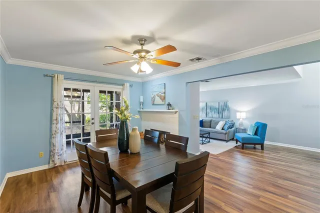 a view of a dining room with furniture window and wooden floor
