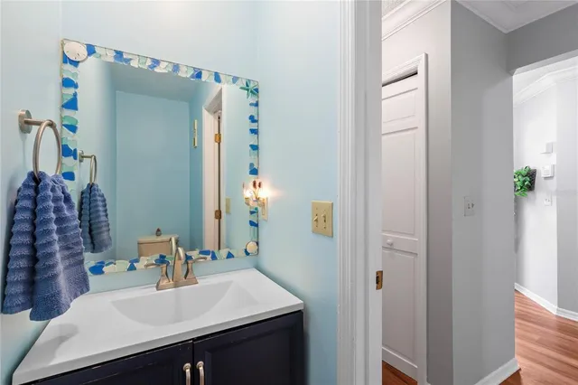 a bathroom with a sink vanity and a mirror
