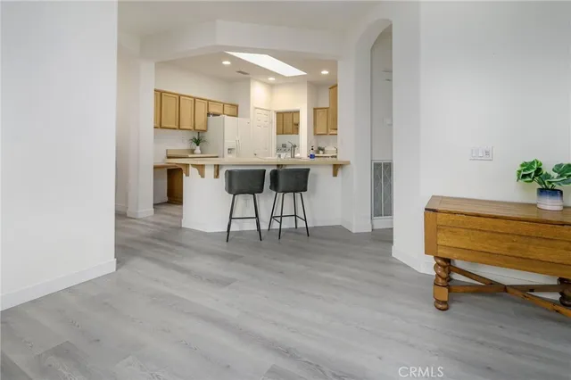 a white refrigerator freezer sitting inside of a kitchen