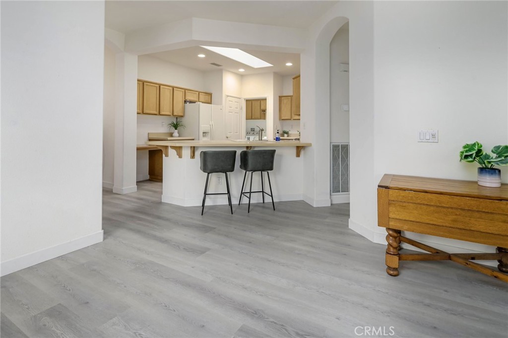 9141 Filaree Court Corona, CA 92883 - Photo 11 of 54 a view of kitchen with furniture and wooden floor
