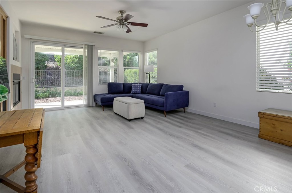 9141 Filaree Court Corona, CA 92883 - Photo 17 of 54 a living room with furniture and a window