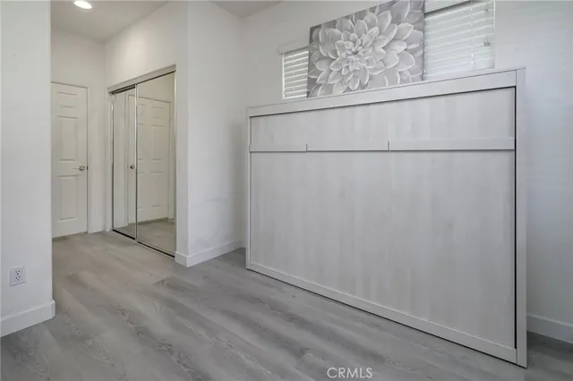 a view of a patio with a table chairs and a backyard