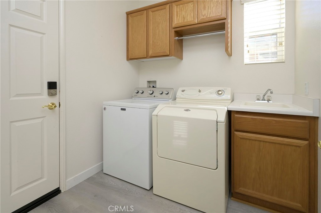 9141 Filaree Court Corona, CA 92883 - Photo 30 of 54 a utility room with dryer and washer
