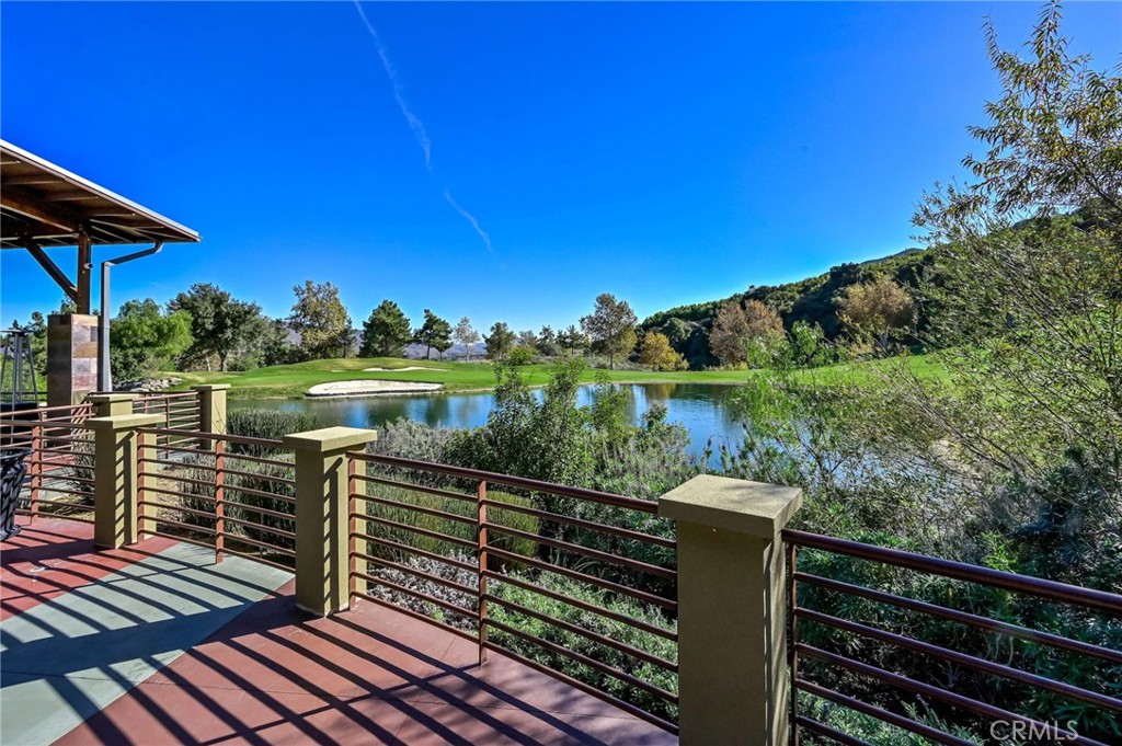 9141 Filaree Court Corona, CA 92883 - Photo 48 of 54 a balcony with wooden floor next to a yard