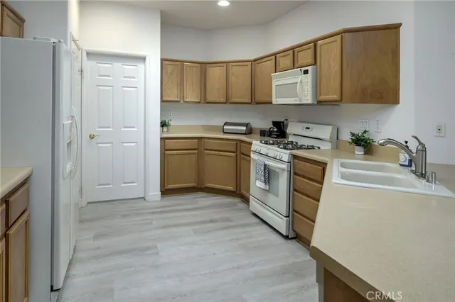 a view of kitchen with furniture and wooden floor