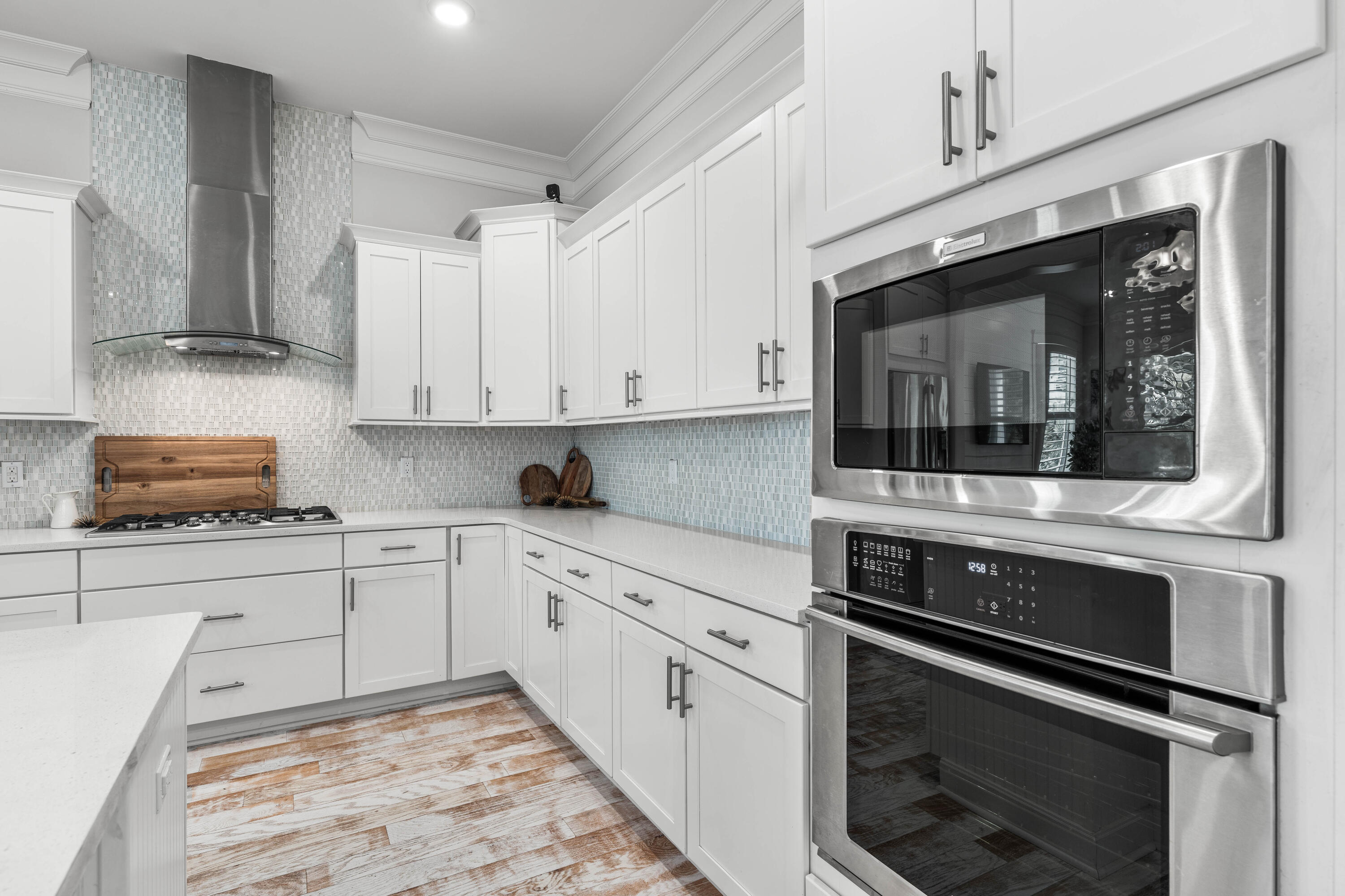 164 Clipper Street Inlet Beach, FL 32461 - Photo 11 of 75 a kitchen with granite countertop white cabinets stainless steel appliances and sink