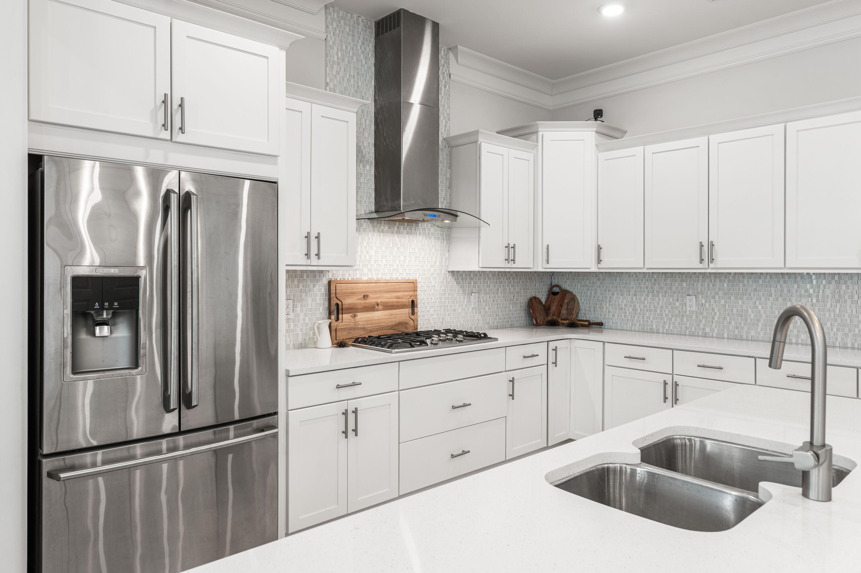 164 Clipper Street Inlet Beach, FL 32461 - Photo 12 of 75 a kitchen with stainless steel appliances granite countertop a refrigerator sink and cabinets