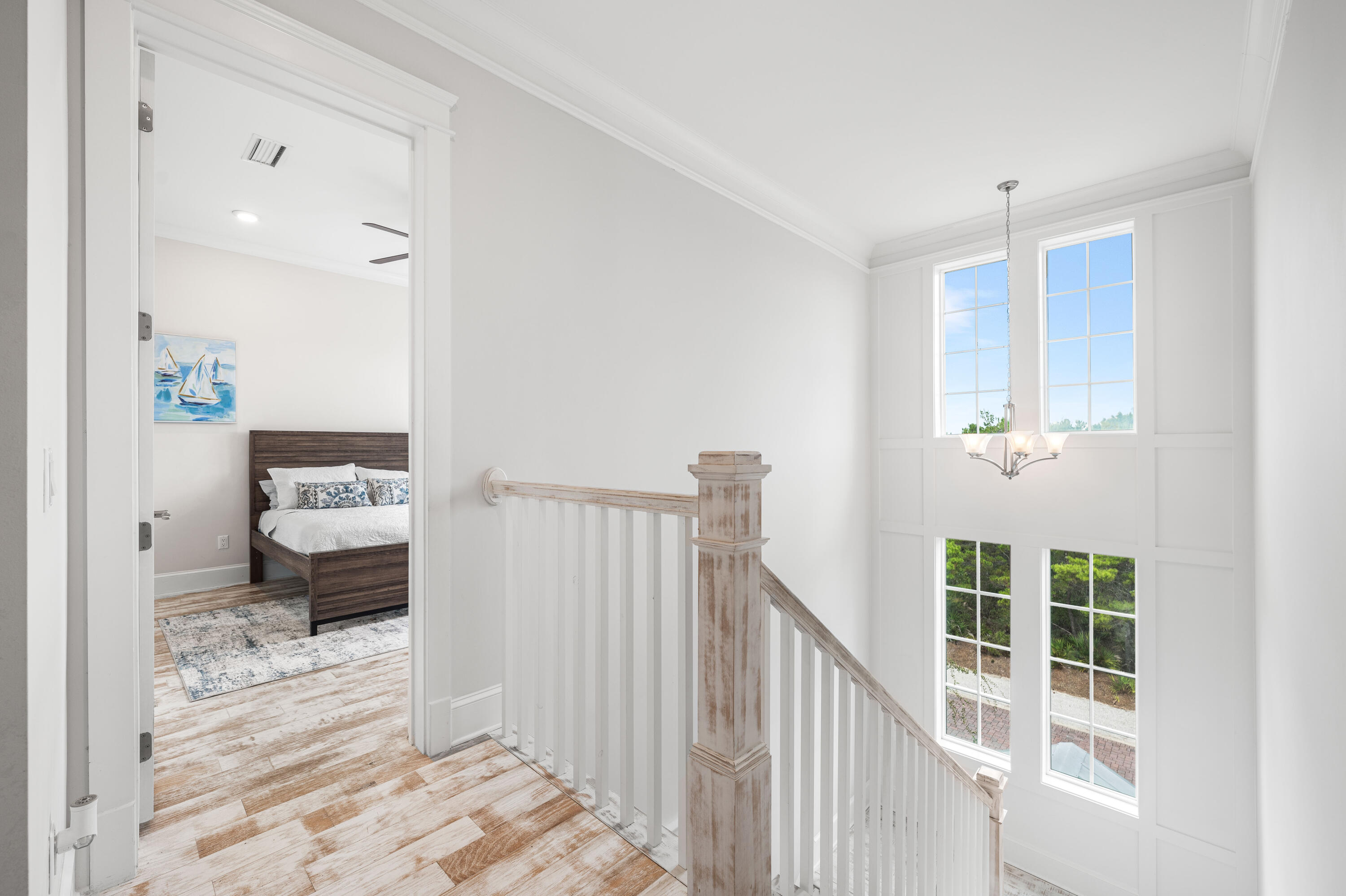 164 Clipper Street Inlet Beach, FL 32461 - Photo 36 of 75 a view of a bedroom with wooden floor and windows