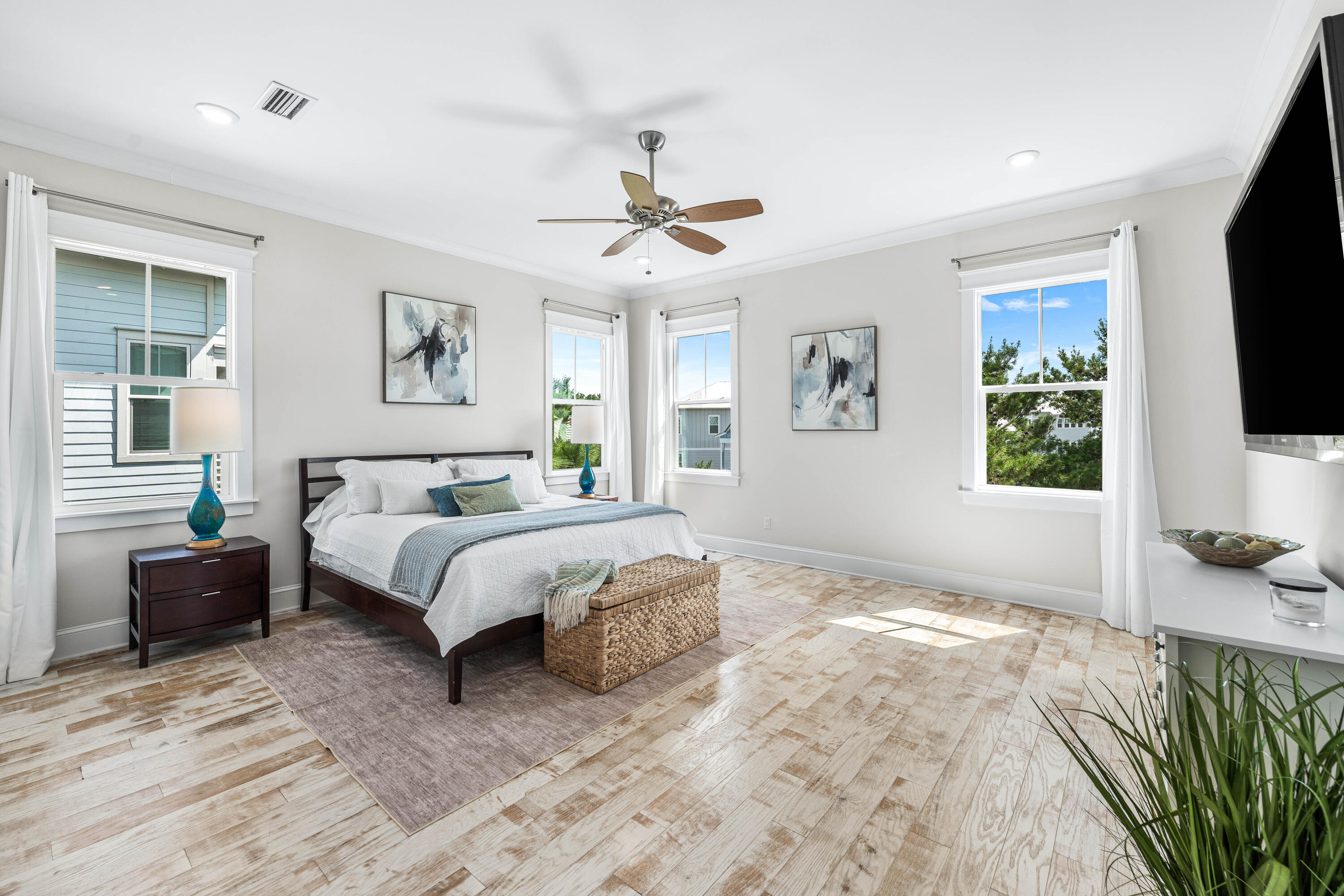 164 Clipper Street Inlet Beach, FL 32461 - Photo 47 of 75 a spacious bedroom with a bed and a flat screen tv