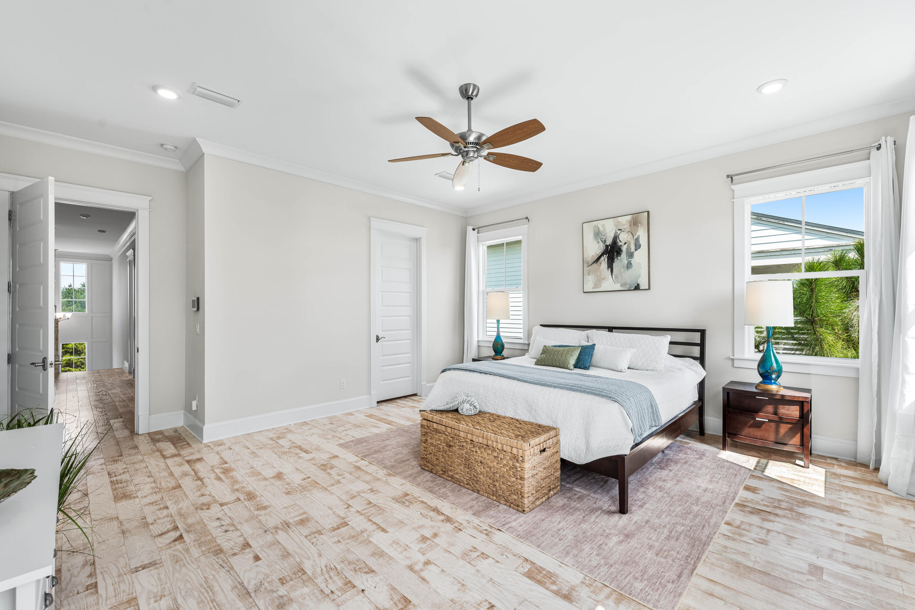 164 Clipper Street Inlet Beach, FL 32461 - Photo 48 of 75 a spacious bedroom with a bed and ceiling fan