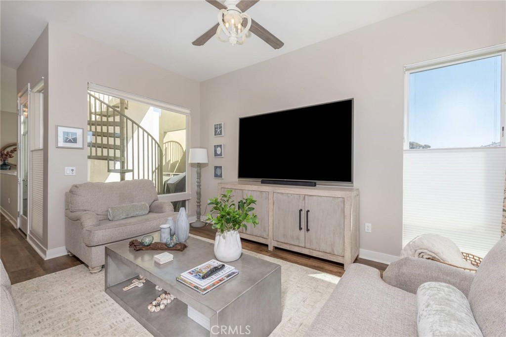 2148 Doheny Way Dana Point, CA 92629 - Photo 23 of 31 a living room with furniture a flat screen tv and a window