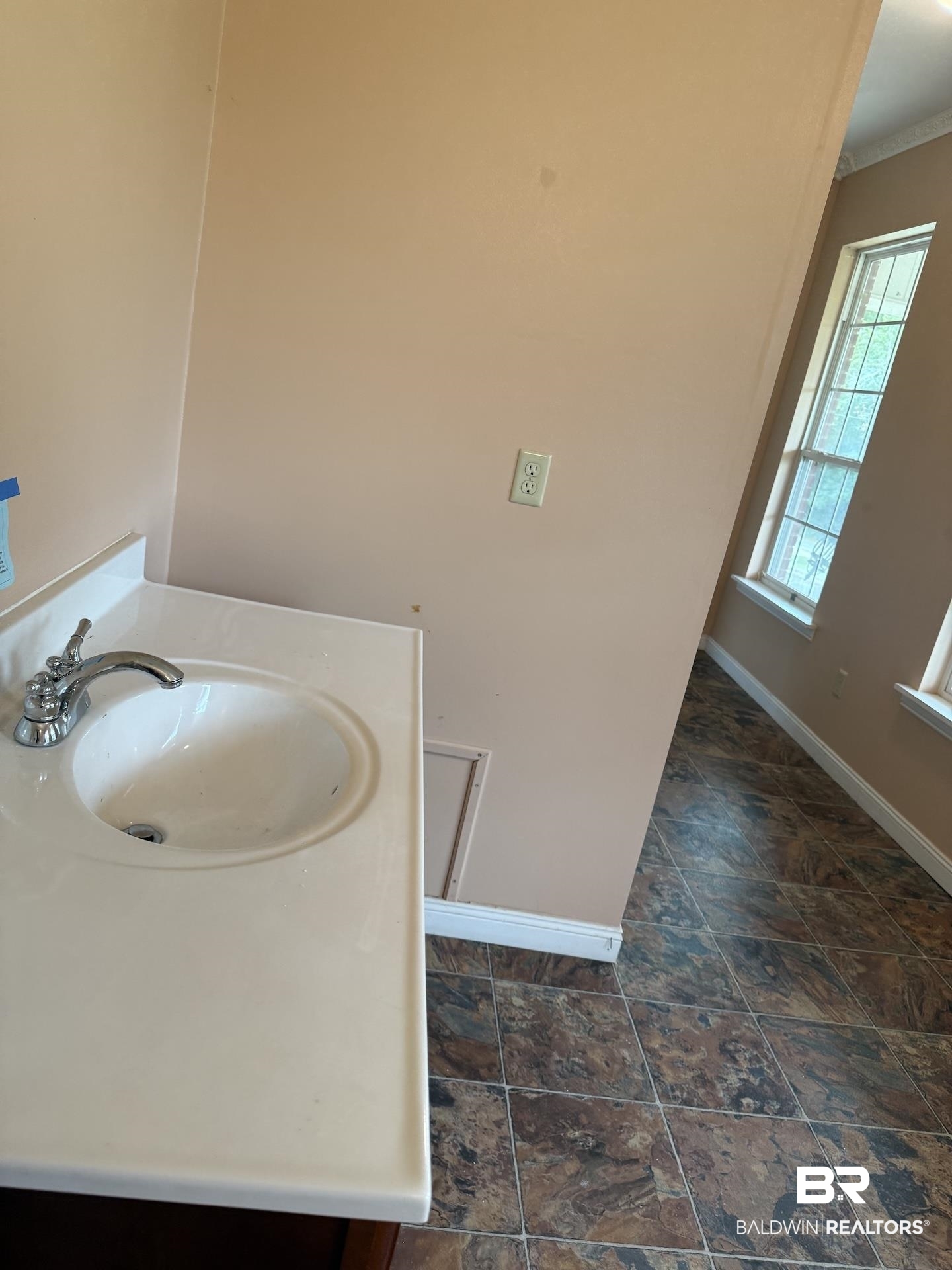 99 Cemetery Street Uriah, AL 36480 - Photo 11 of 13 Bathroom with vanity and dark stone finish floors