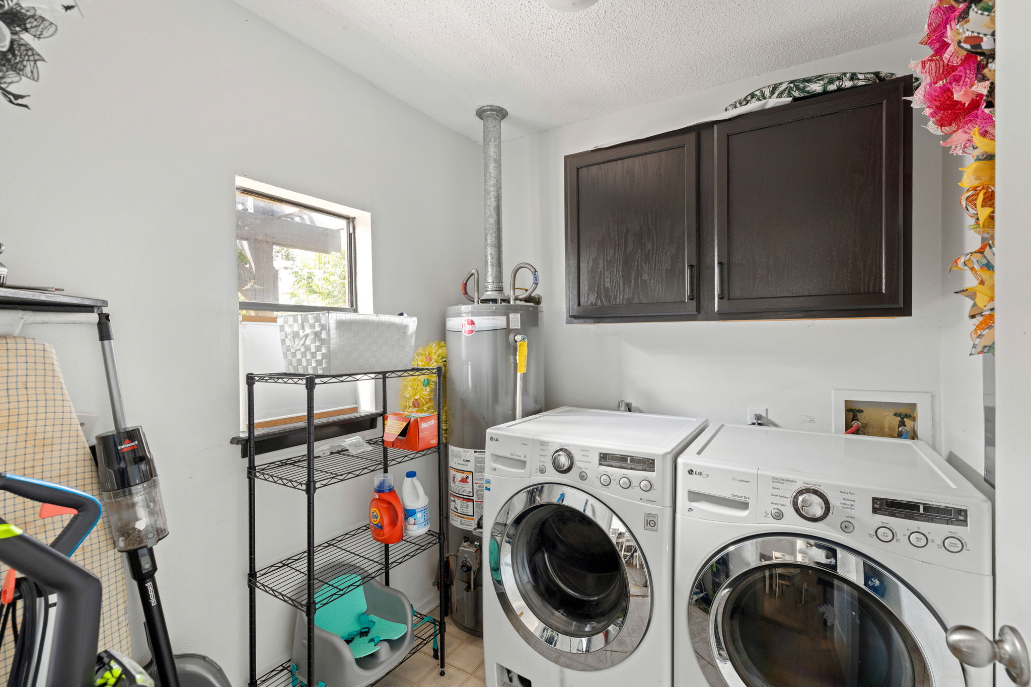 116 South Hackberry Avenue Luling, TX 78648 - Photo 15 of 39 a view of a storage and utility room with washer and dryer