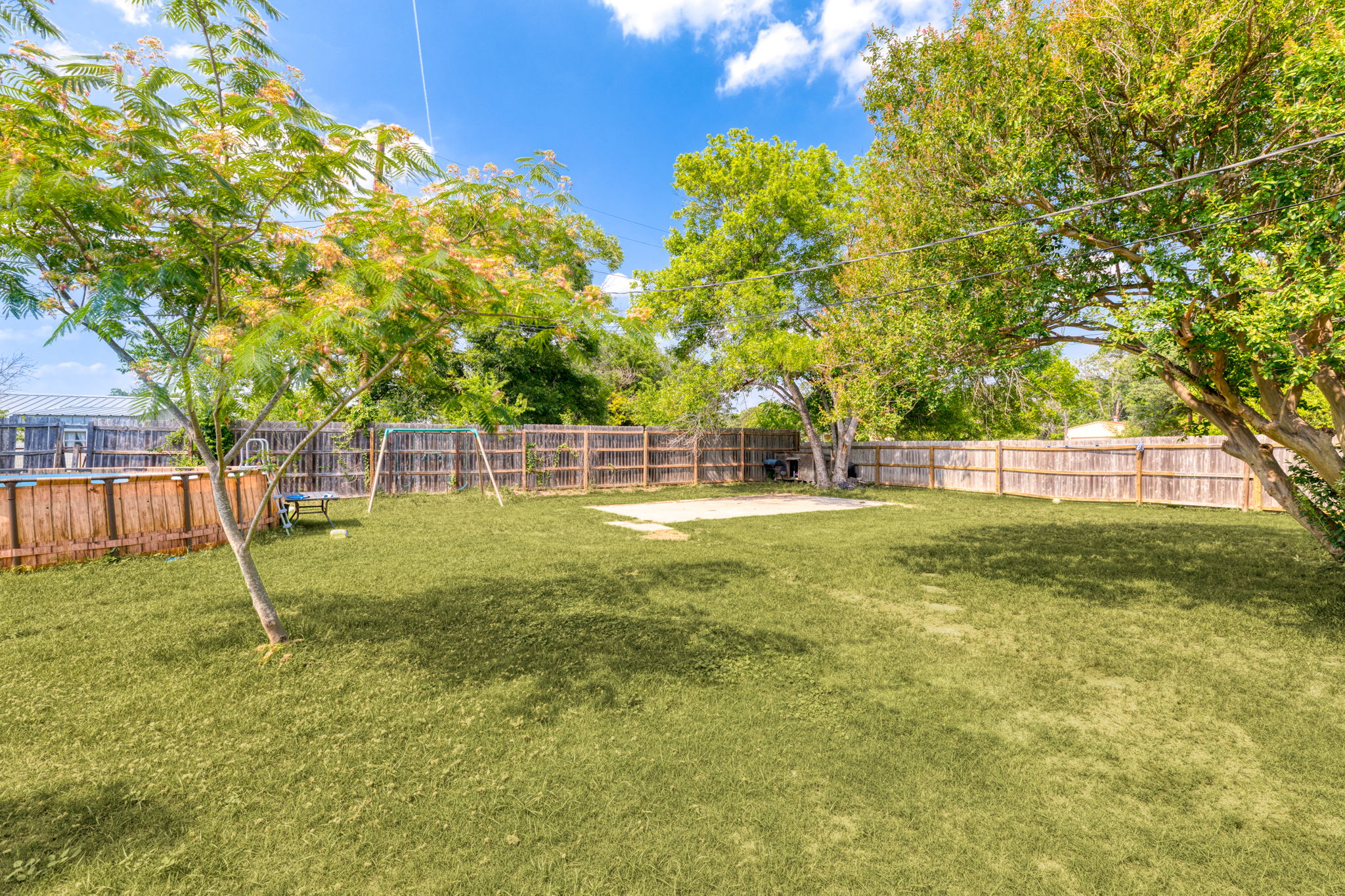 116 South Hackberry Avenue Luling, TX 78648 - Photo 25 of 39 a view of yard with swimming pool and deck