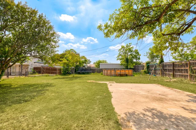 a view of a playground with a garden