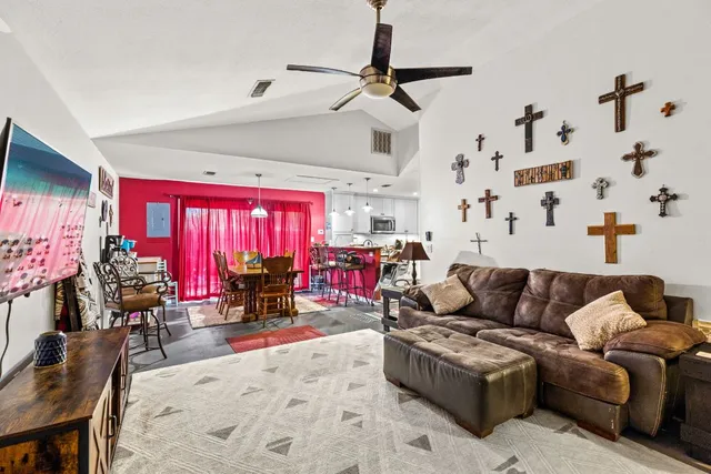 a living room with furniture and a large window